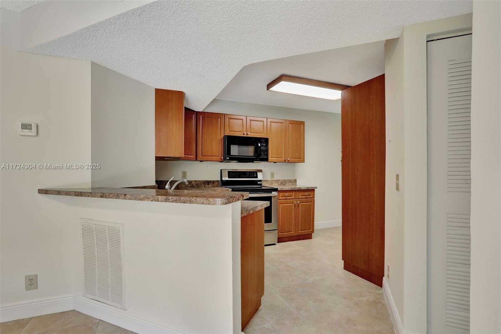 Small Image of 8891 Wiles Rd, Coral Springs, FL 33067, USA Number 3