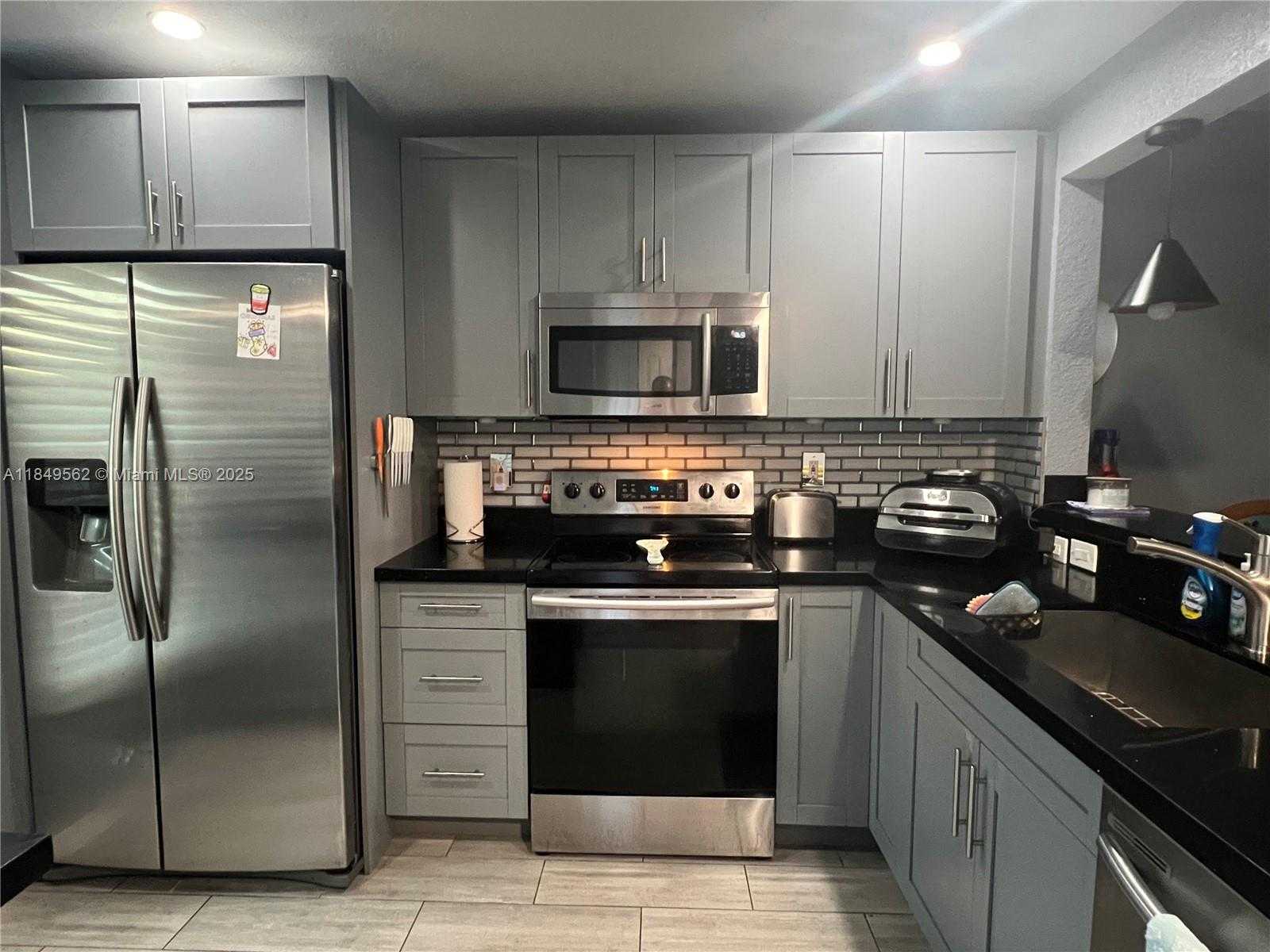 Small Image of 5830 NORTH WEST 64TH AVE #103, Tamarac Number 1